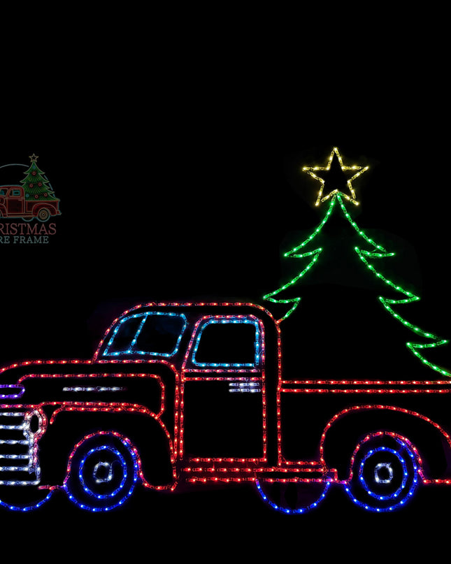 Decorative light display of a red truck with a Christmas tree on a black background.